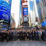 Quinnipiac GAME Forum Displayed in New York, Time Square and all Austin College Members in suits take a photograph