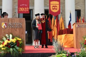 President O'Day with graduate